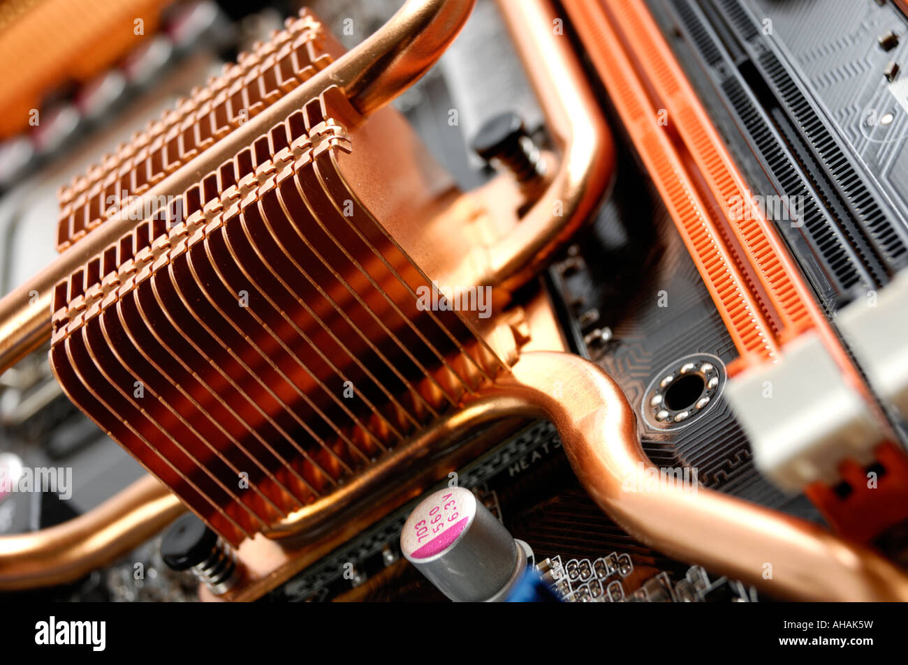 Copper radiator cooler on a computer motherboard Stock Photo Alamy