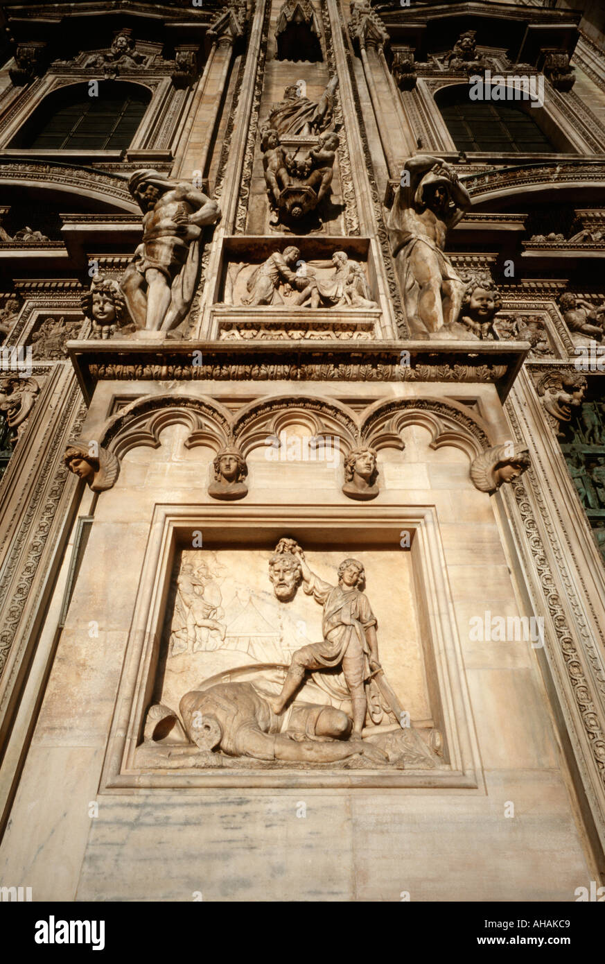 Milan Italy Marble relief on the facade of the Duomo depicting Davids victory over Goliath Stock Photo