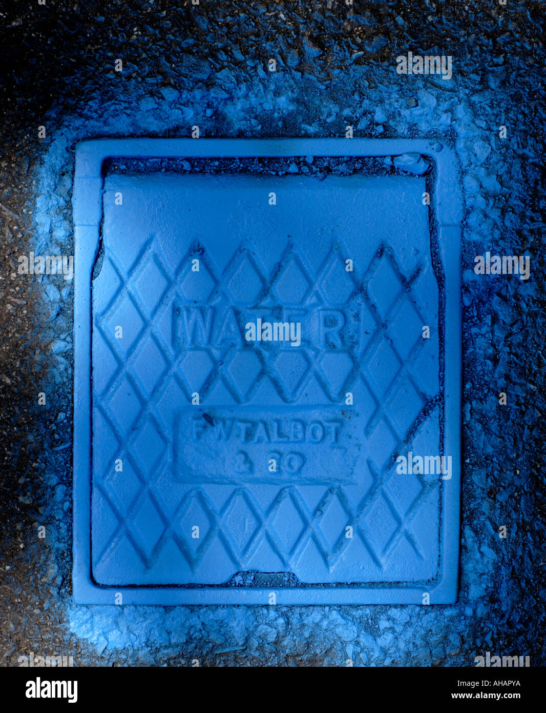 Blue painted street water meter inspection cover Stock Photo Alamy