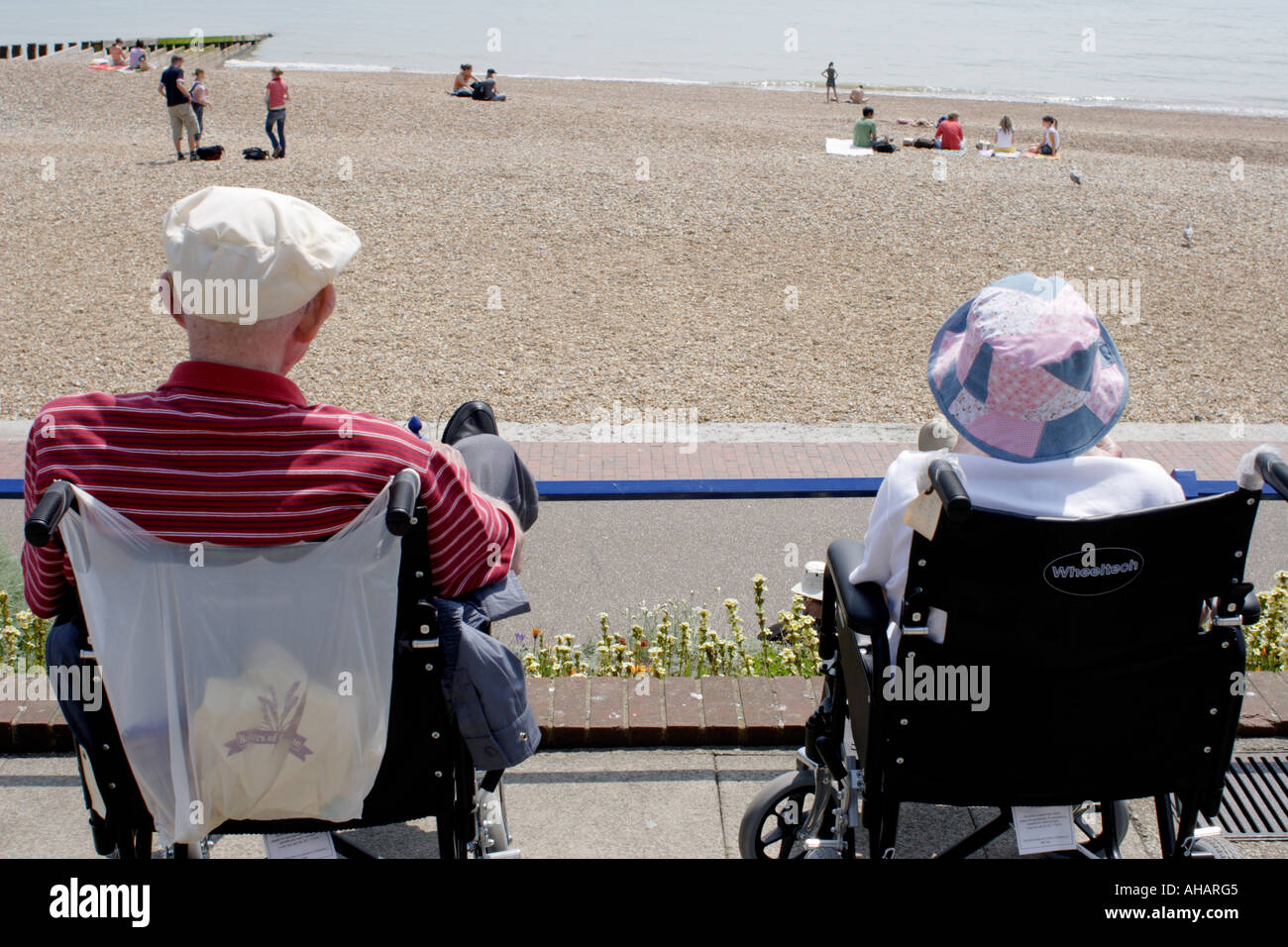 Elderly couple in wheelchairs on Eastbourne seafront Stock Photo Alamy