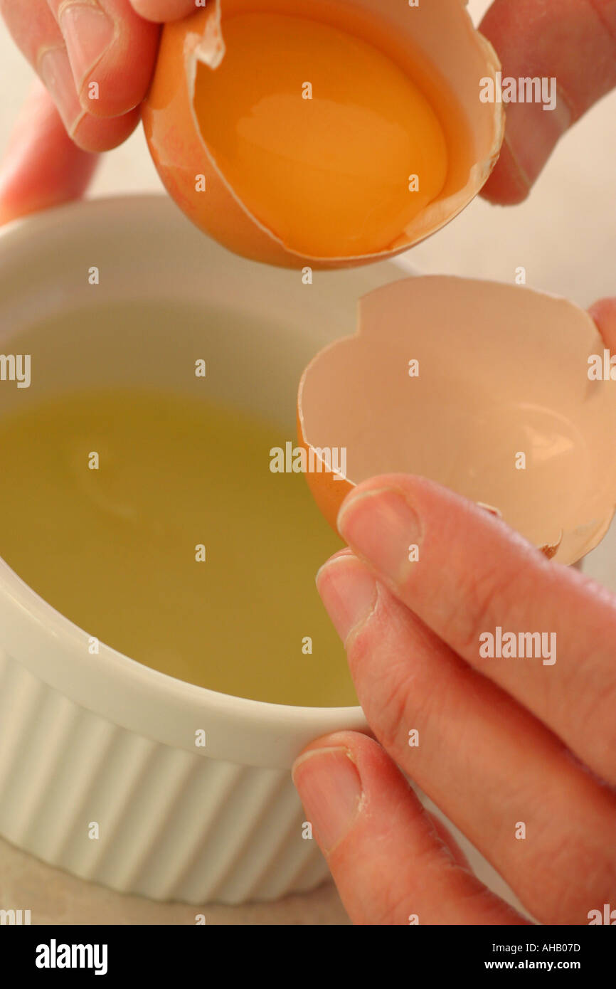 separating egg yolk Stock Photo Alamy