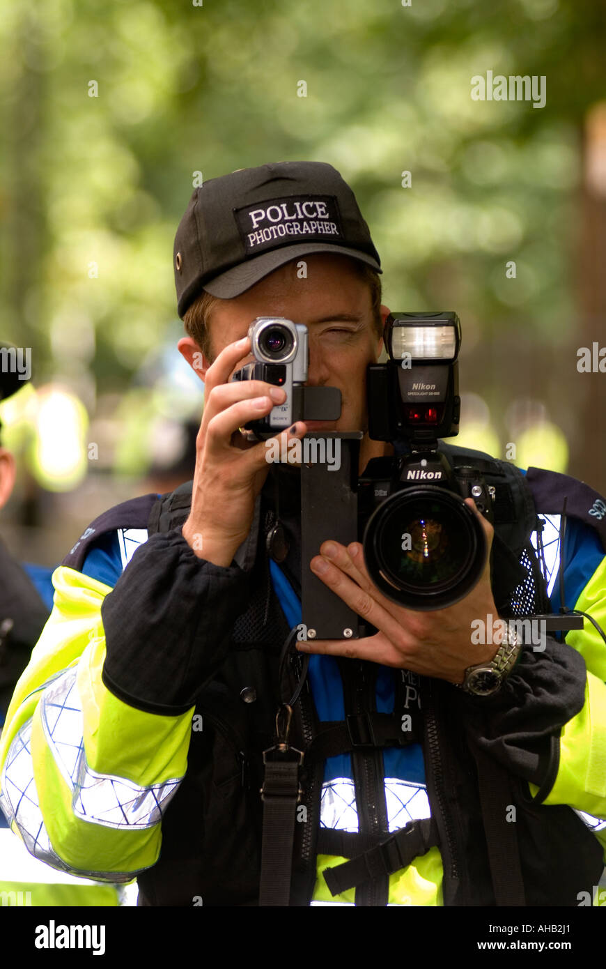 Police photographer working at Stop the War Demo and march London 5 August 2006 Stock Photo