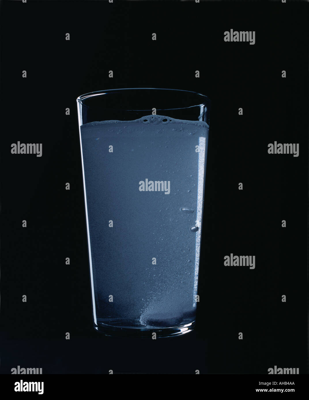 glass of water with bubbling tablets Stock Photo