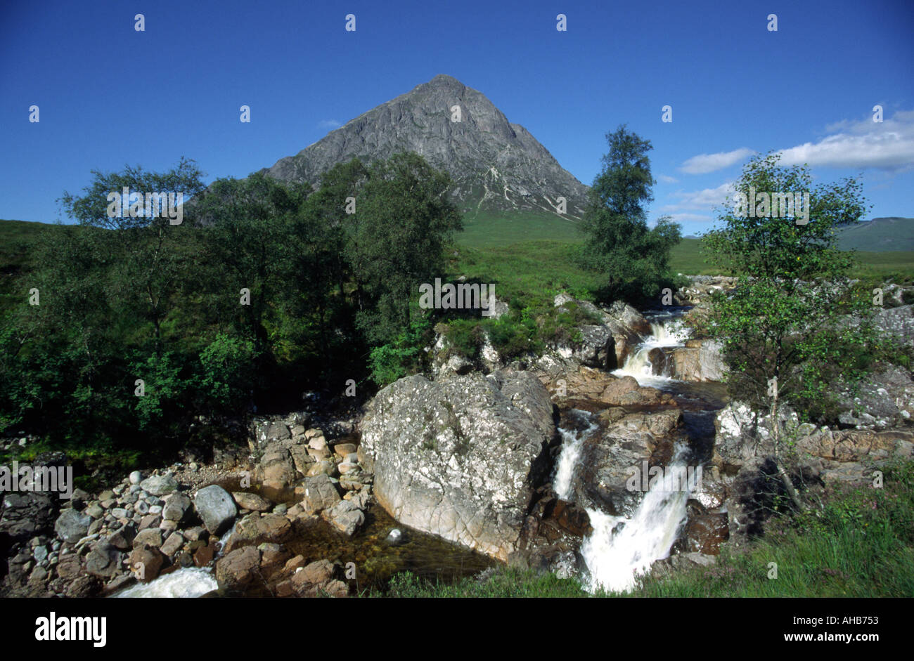Buachaille Etive Mor mountain in Glen Coe Highland Scotland with Etive Mor waterfall in front Stock Photo