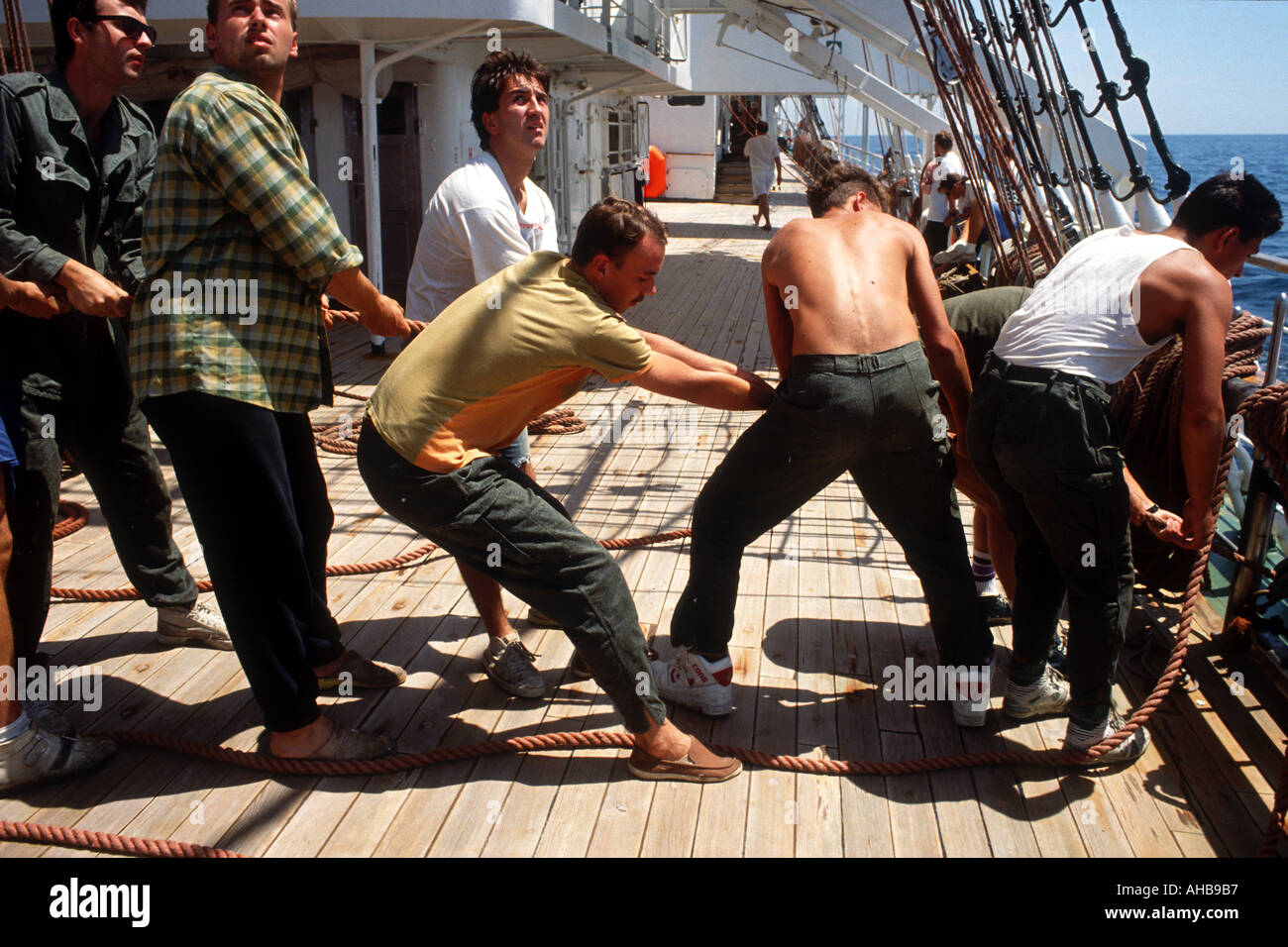 July 1992 New York USA Life on board the Polish Tall Ship Dar Mlodziezy Adjusting the trim of the sails Stock Photo