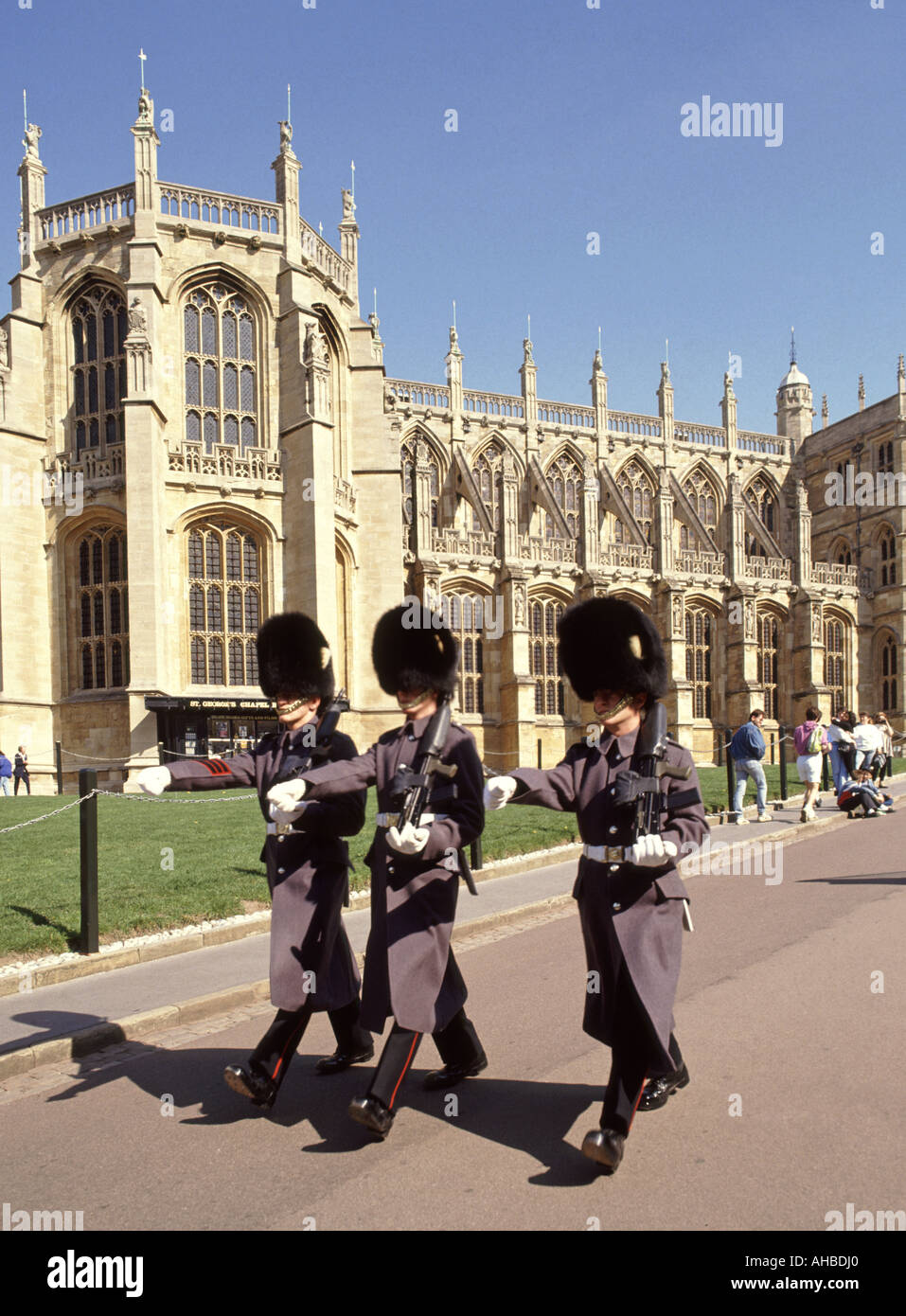 St Georges Chapel Windsor Castle Berkshire England UK British Army Grenadier guardsmen soldiers marching in winter uniform with Bearskin hat & plume Stock Photo