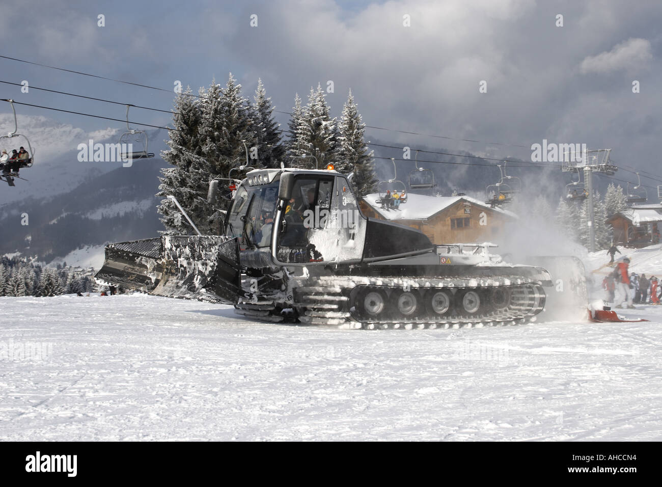 Snow plough or dameuse piste basher in snow ski resort area of Morzine