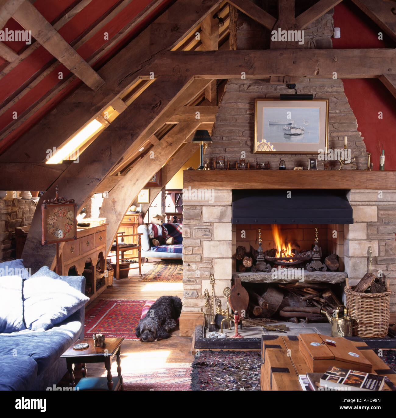 stone fireplace barn conversion living room beamed apex ceiling oak crossbars
