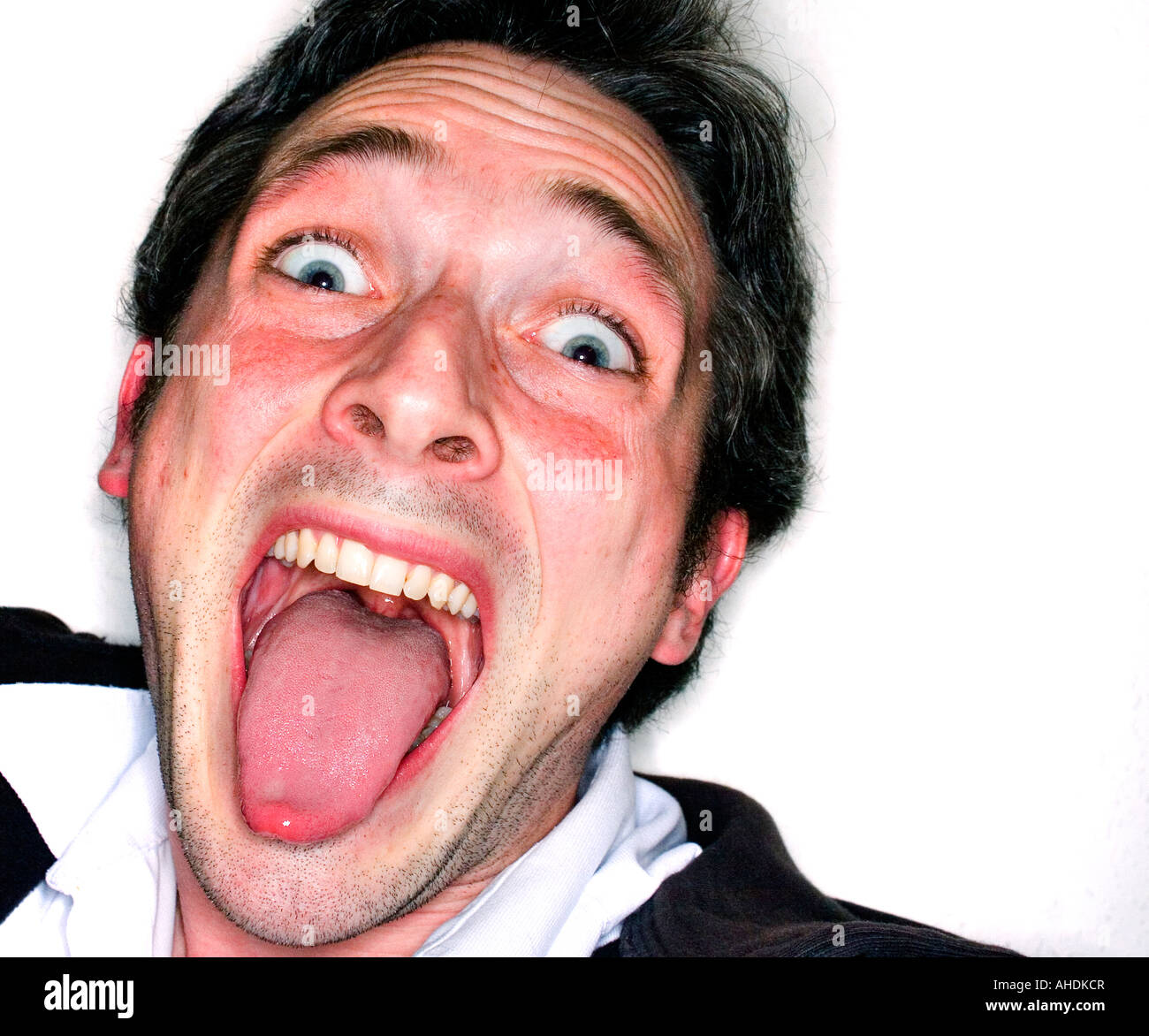 Man sticks his tongue out Stock Photo