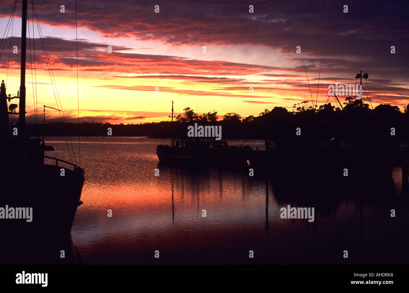 Fishing boats and Georges Bay at dawn, St. Helens, Tasmania, Australia