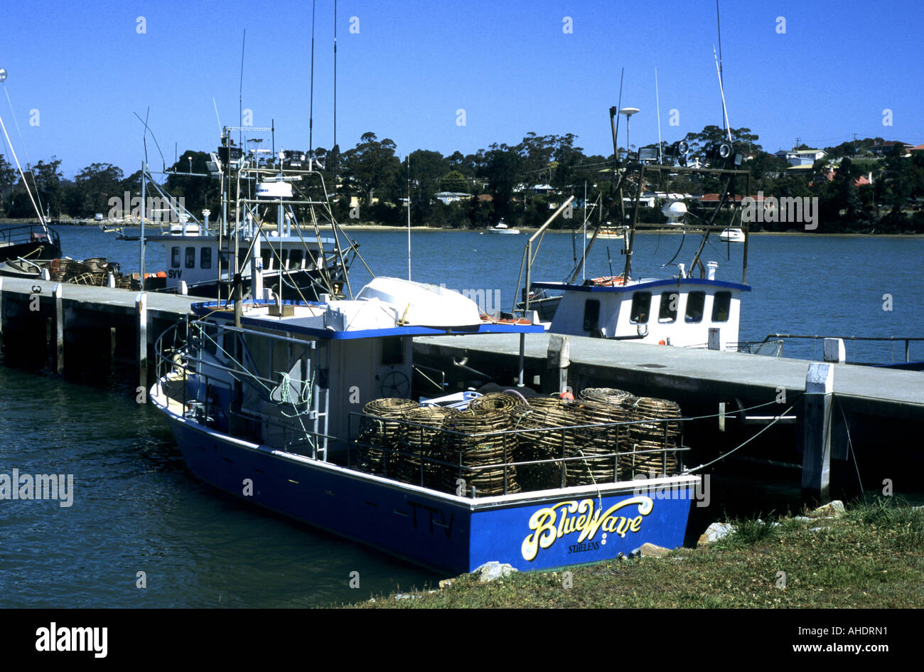 Fishing boats and Georges Bay, St. Helens, Tasmania, Australia Stock