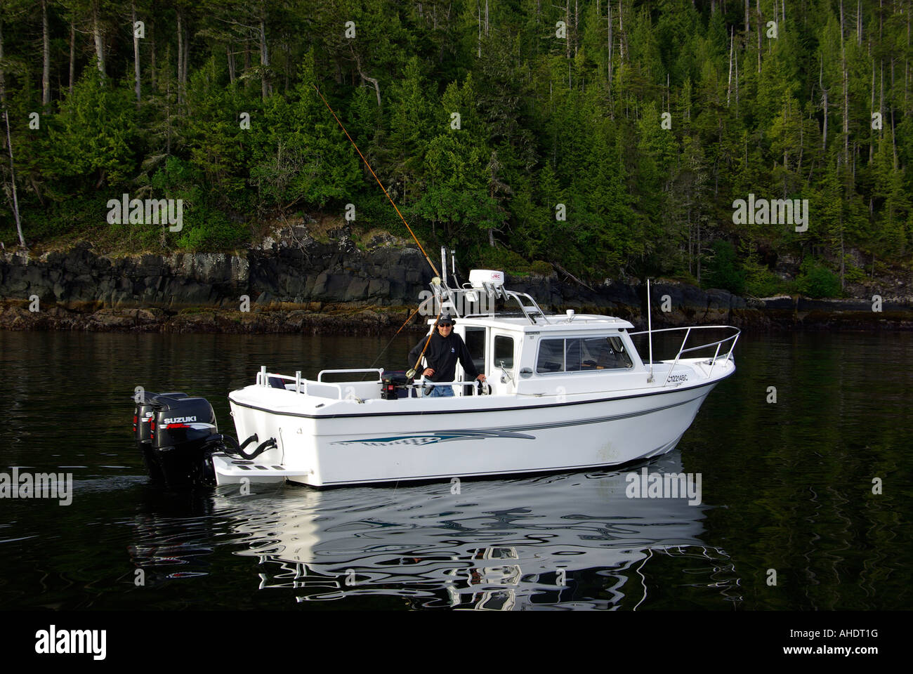 Guide Todd Fogarty in Seawest cabin cruiser at Duval Point near Port Hardy, British Columbia Stock Photo