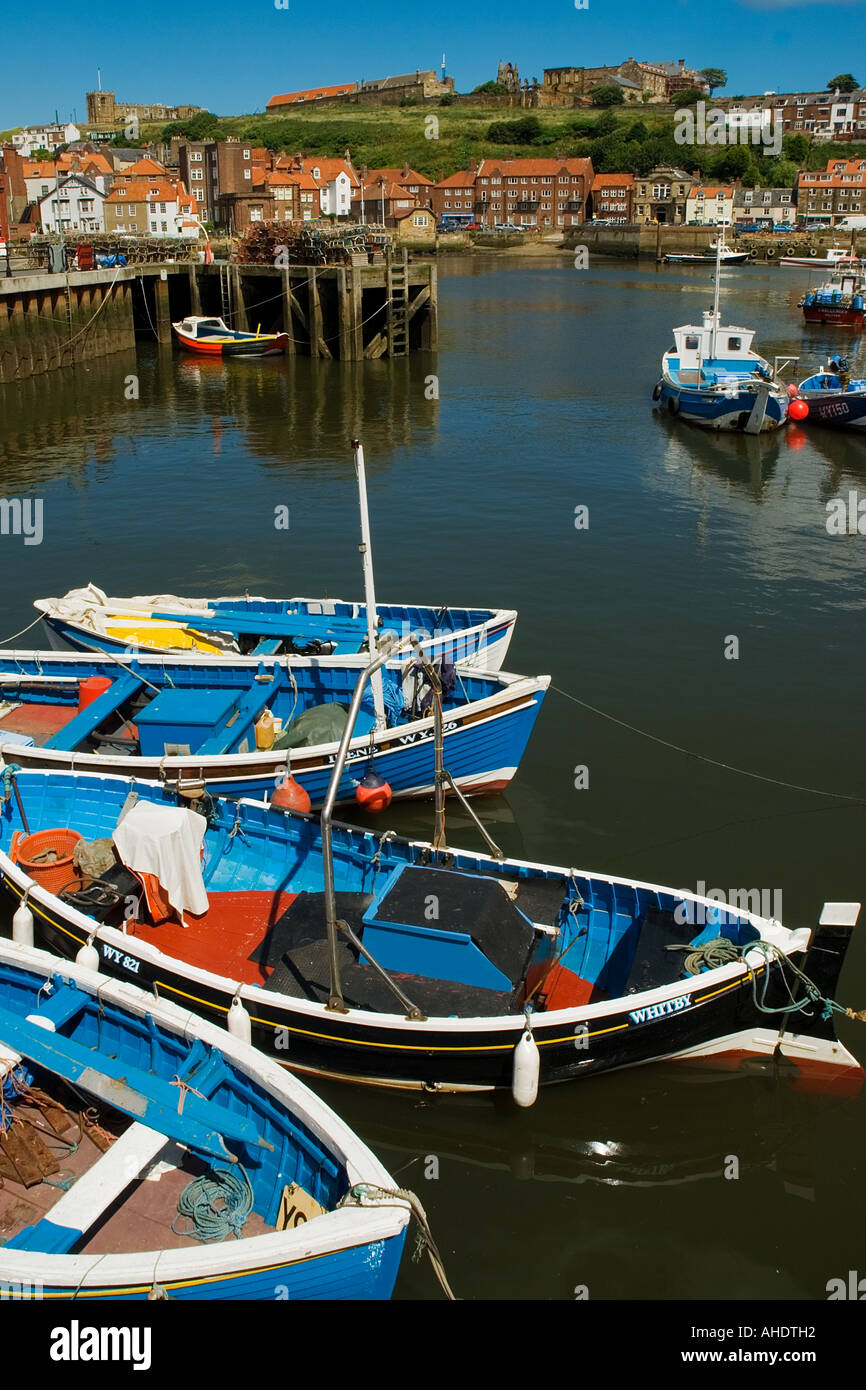 Small fishing boats in the harbour Whitby North Yorkshire England Stock ...