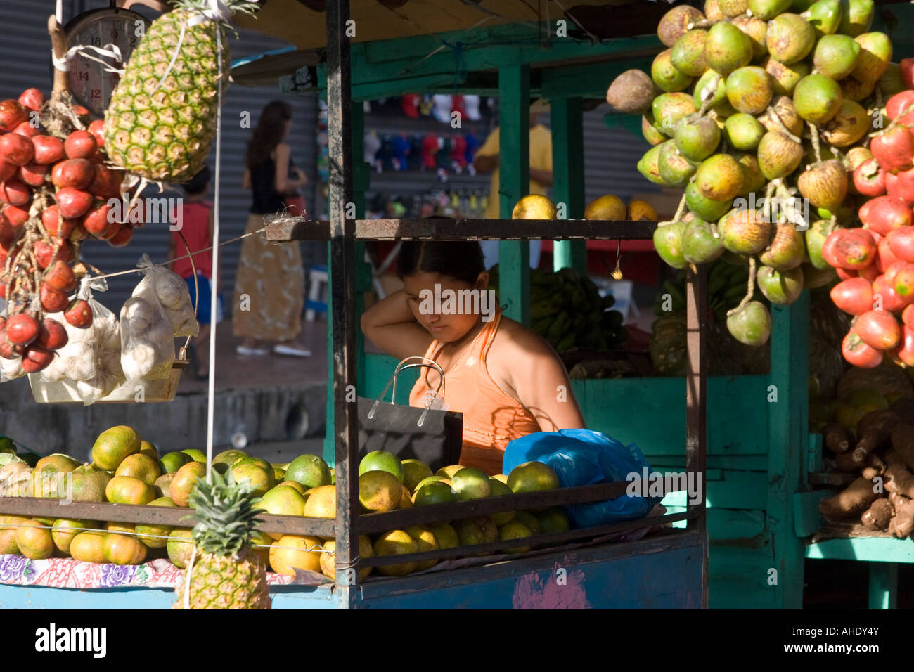 A young girl sells produce at El Mosquero, Santiago's public market. Santiago, Veraguas, Republic of Panama Central America Stock Photo