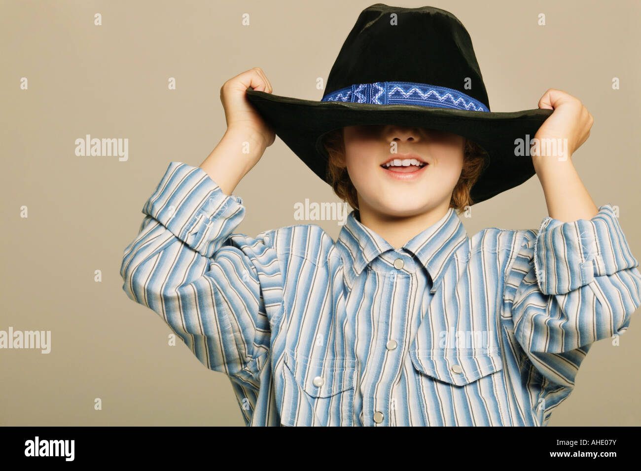 Young boy wearing cowboy hat Stock Photo