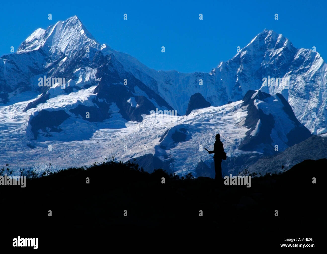 Silhouette of a man in front of the alpine glaciers covering the Fairweather Mountain Range, Glacier Bay National Park, AK, USA Stock Photo