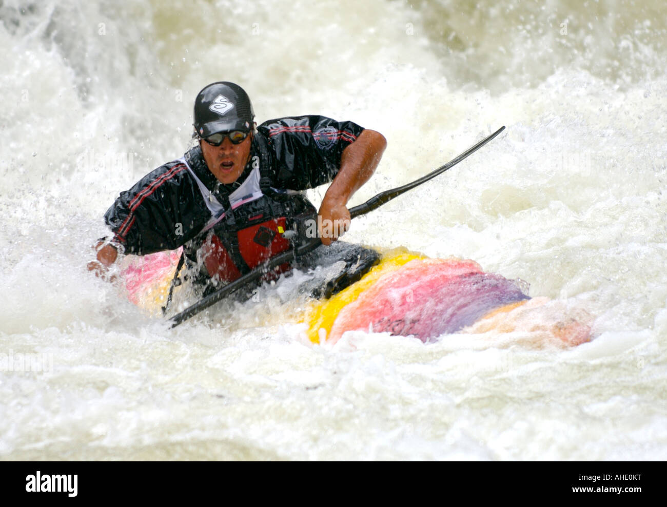 Man paddles a whitewater kayak through the class V rapid Tunnel Falls