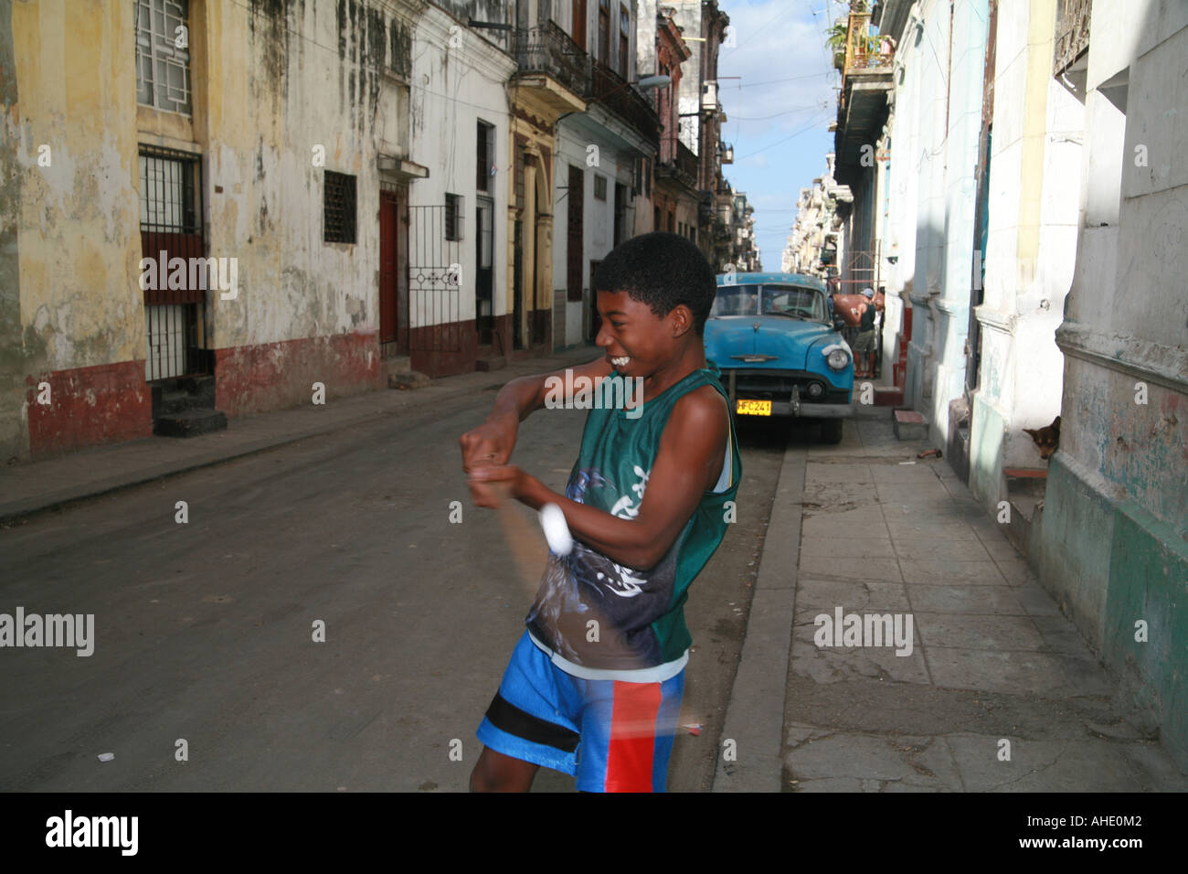 Cuba Havana Kids playing baseball in the street Stock Photo