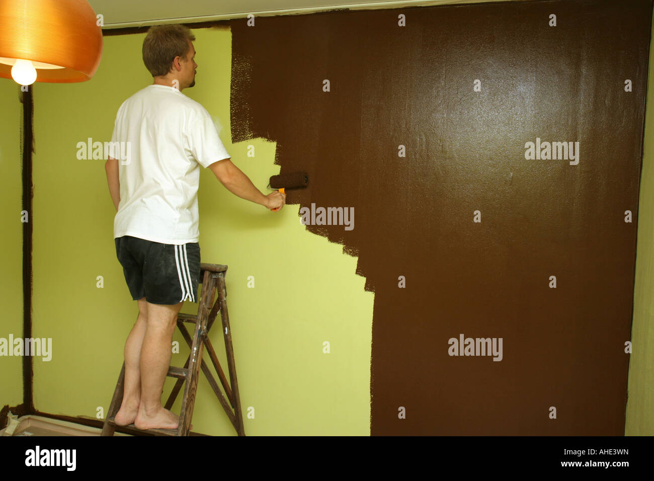 Painting on a ladder hi-res stock photography and images - Alamy