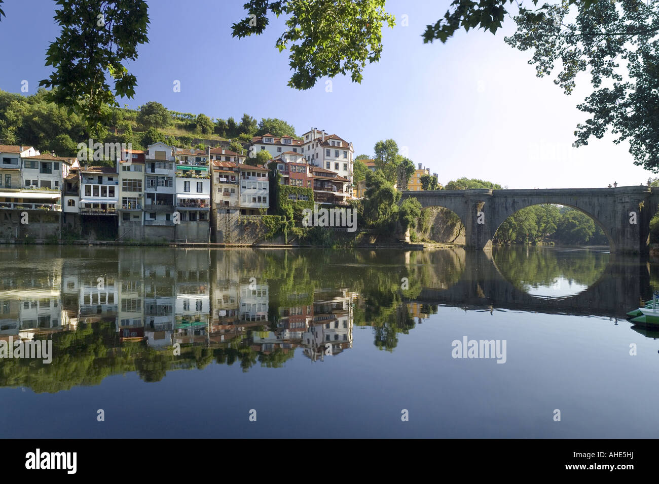 Portugal the Costa Verde, Amarante, the roman bridge over the river Tamega, part of town with river view restaurants Stock Photo