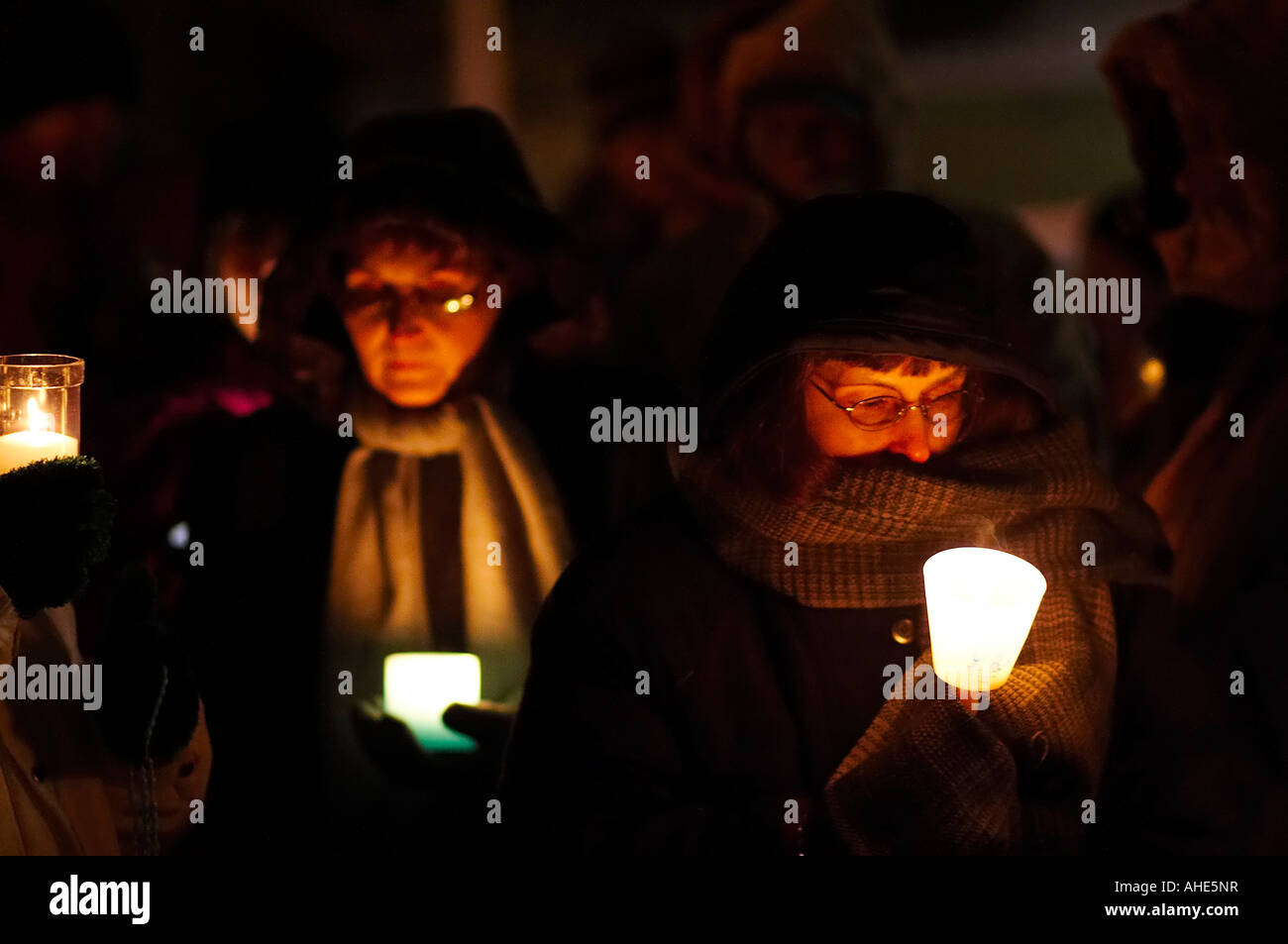 Women holding candles and praying for an end to abortion during a candlelight vigil Stock Photo