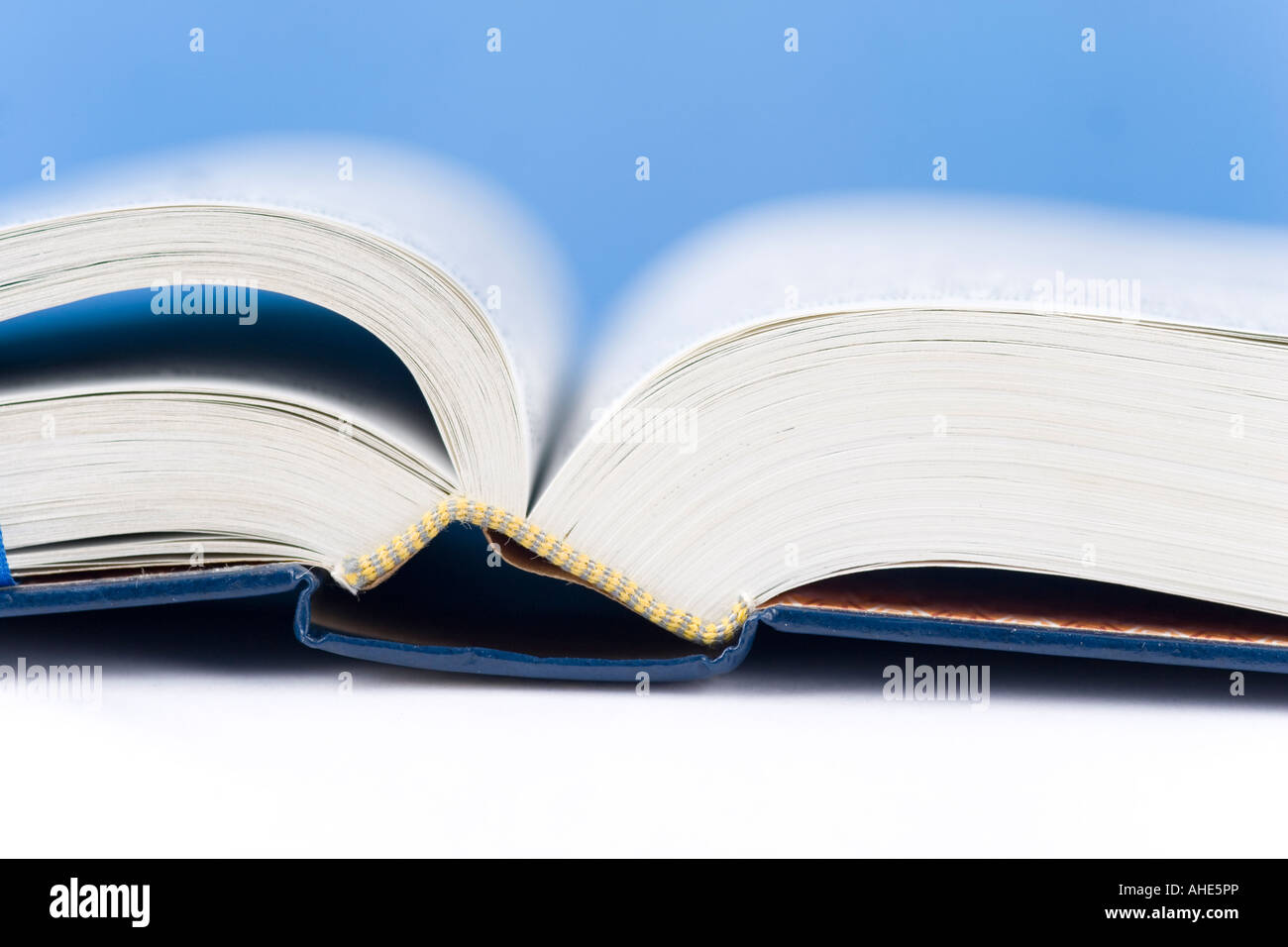 Open book on blue hi-res stock photography and images - Alamy