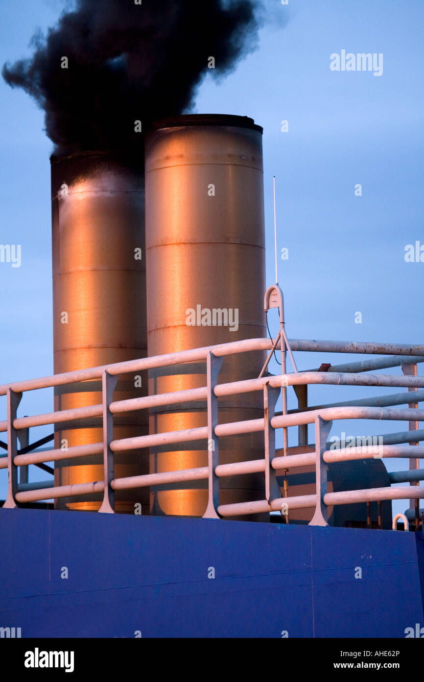 A lot of black smoke coming up a common phenomenon when a ships main engines starts Stock
