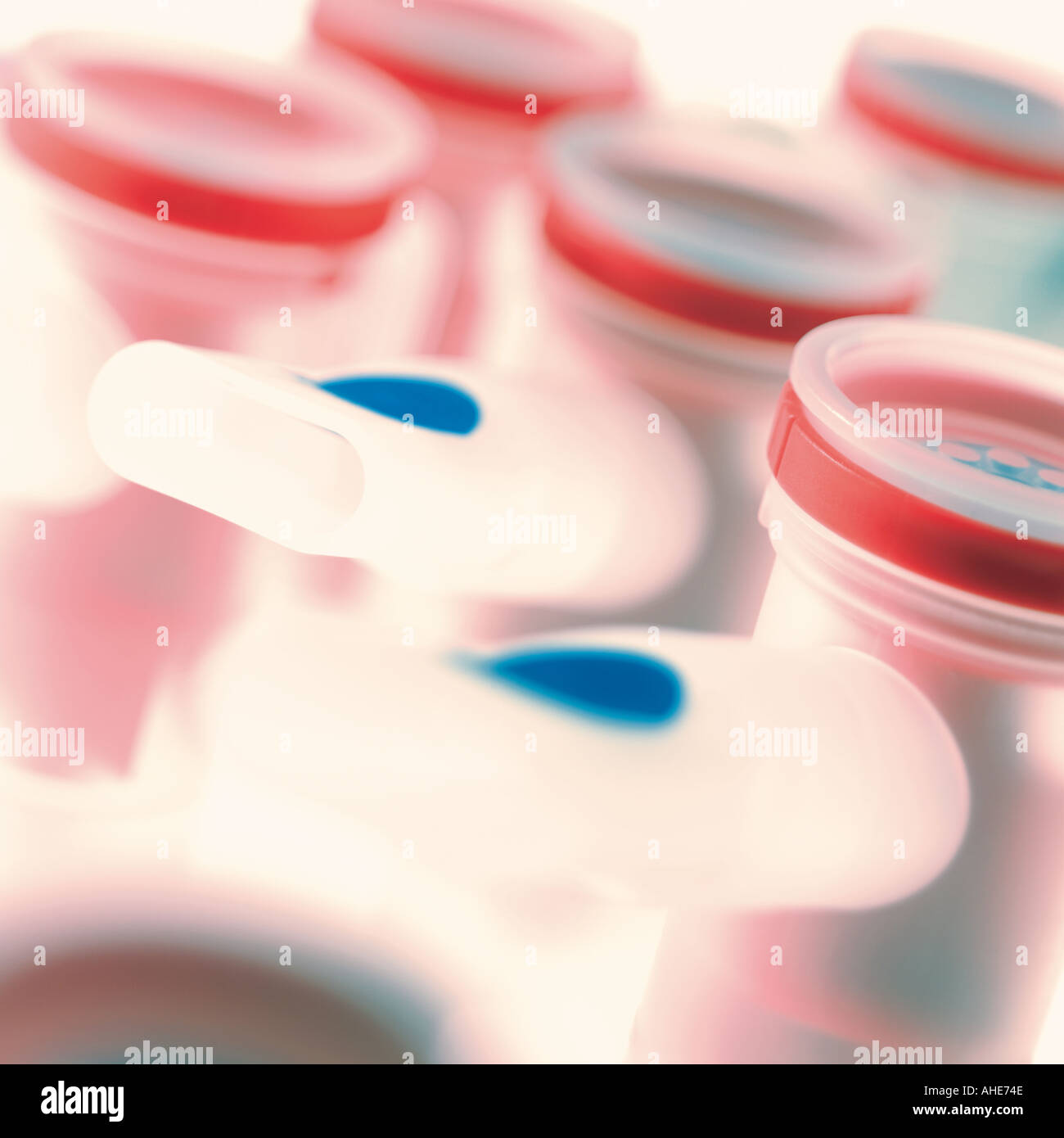 rows of medical inhalers with red caps Stock Photo Alamy