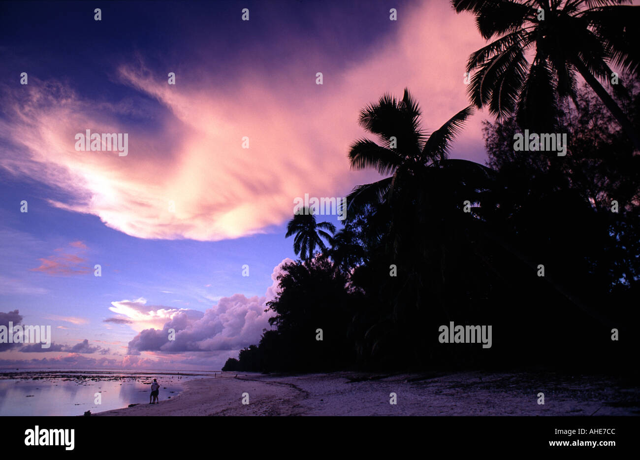 Sunset over a beach and lagoon, Rarotonga, Cook Islands, South Pacific Stock Photo