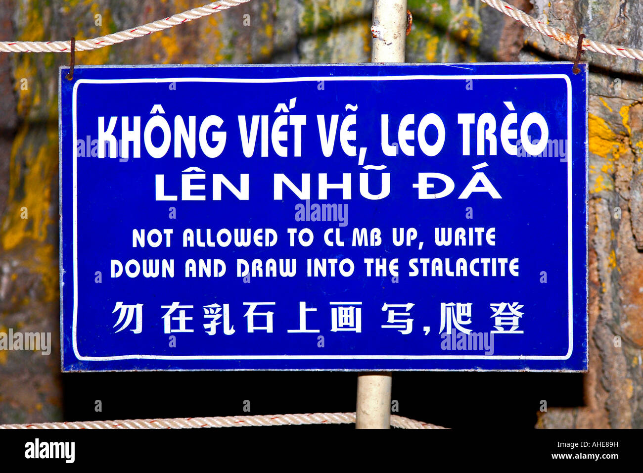 Asia Far East Vietnam  Halong Bay  Hang Sung Sot caves sign at entrance ' not allowed to climb up write down and draw into the stalactite ' Stock Photo