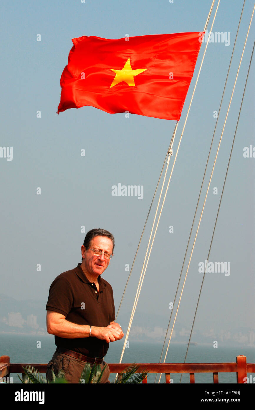 Asia Far East Vietnam Halong Bay Vietnamese national flag flying yellow