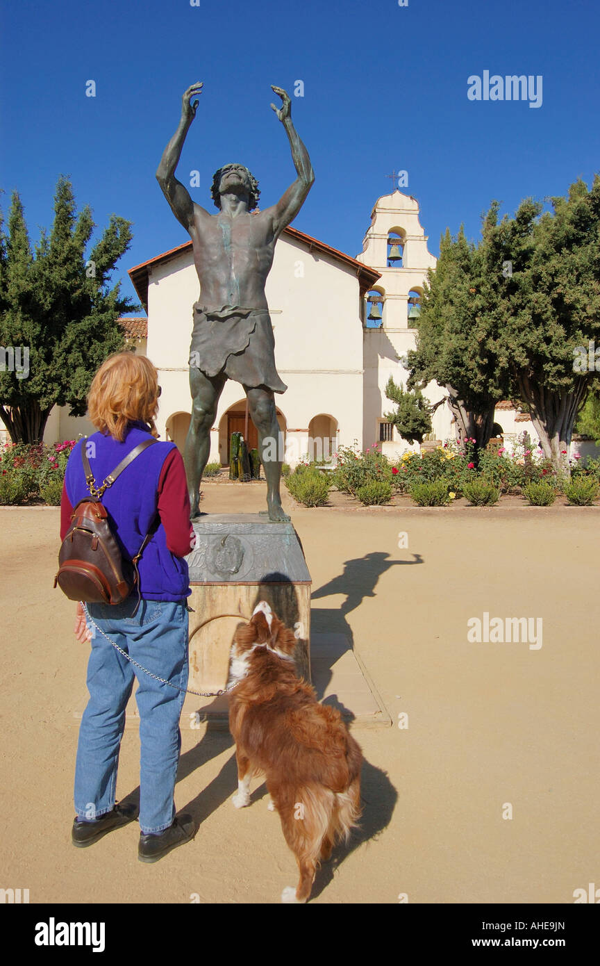 tourist with her dog at Mission San Juan Bautista State Park CA USA Stock Photo