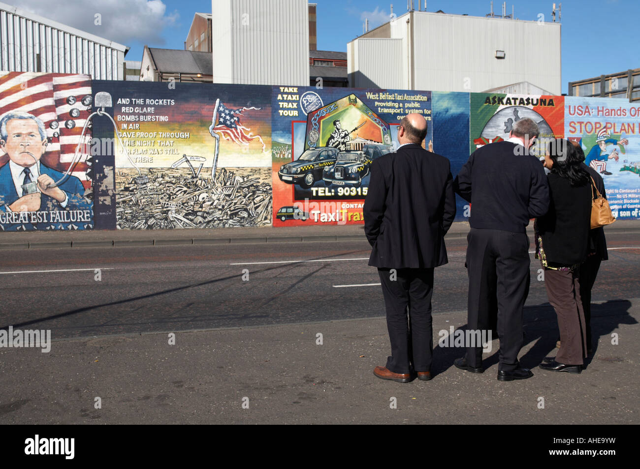 A group of tourists being shown the International wall murals in the republican falls road area