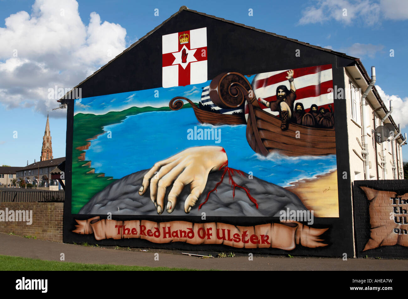 loyalist red hand of ulster legend murals in the Lower Shankill Road area of West Belfast Northern Ireland . Stock Photo