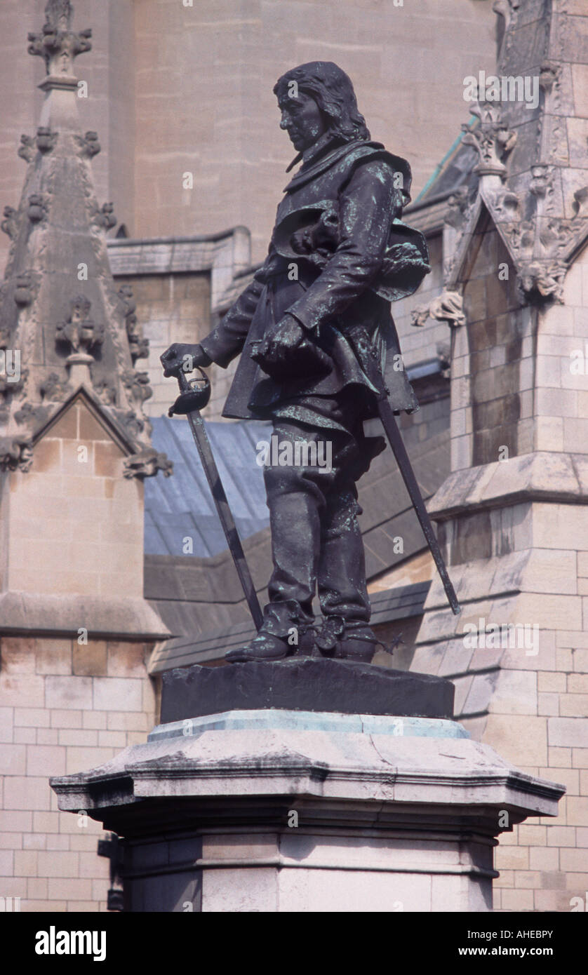 Statue of Oliver Cromwell standing before the Houses of Parliament on Cromwell Green, Westminster, London Stock Photo