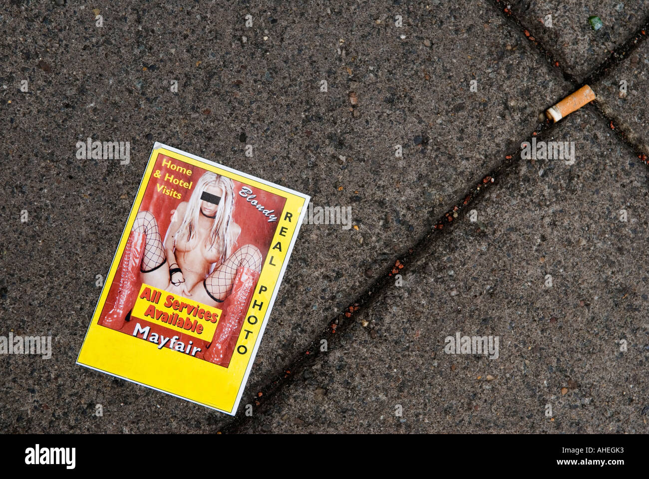 Prostitutes advertisement escort agency card UK. On pavement outside a pay  phone booth Mayfair central London W1 England 2006 2000s HOMER SYKES Stock  Photo - Alamy