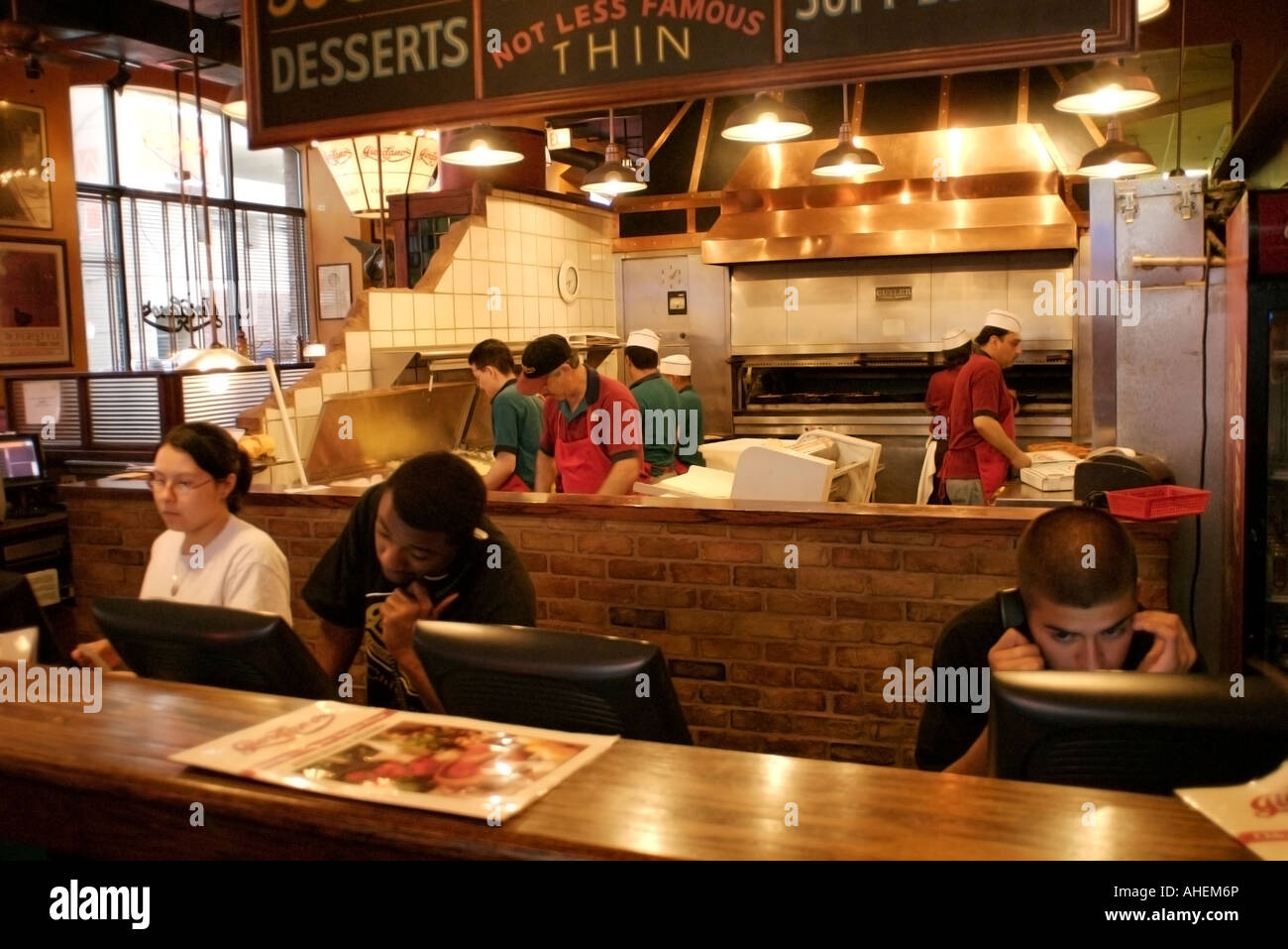 Taking orders and baking deep dish Chicago style pizza at Giordano's ...