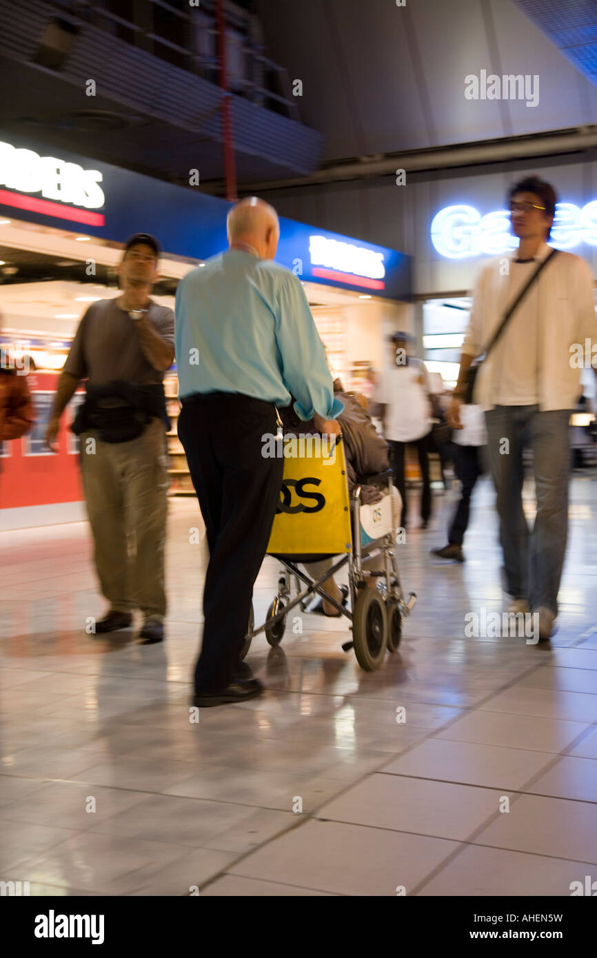 Man pushing wheel chair ramp hires stock photography and images Alamy
