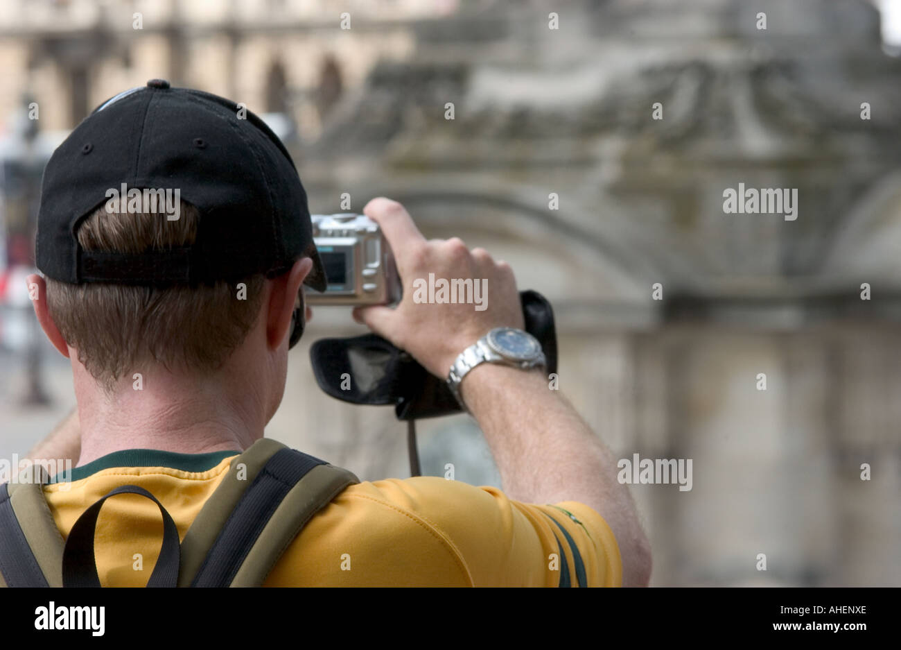 tourist man taking a picture using a digital camera paris france Stock