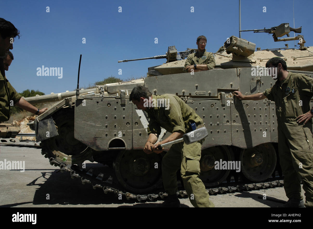 Israeli soldiers change link of a Merkava tank road wheels. Israel