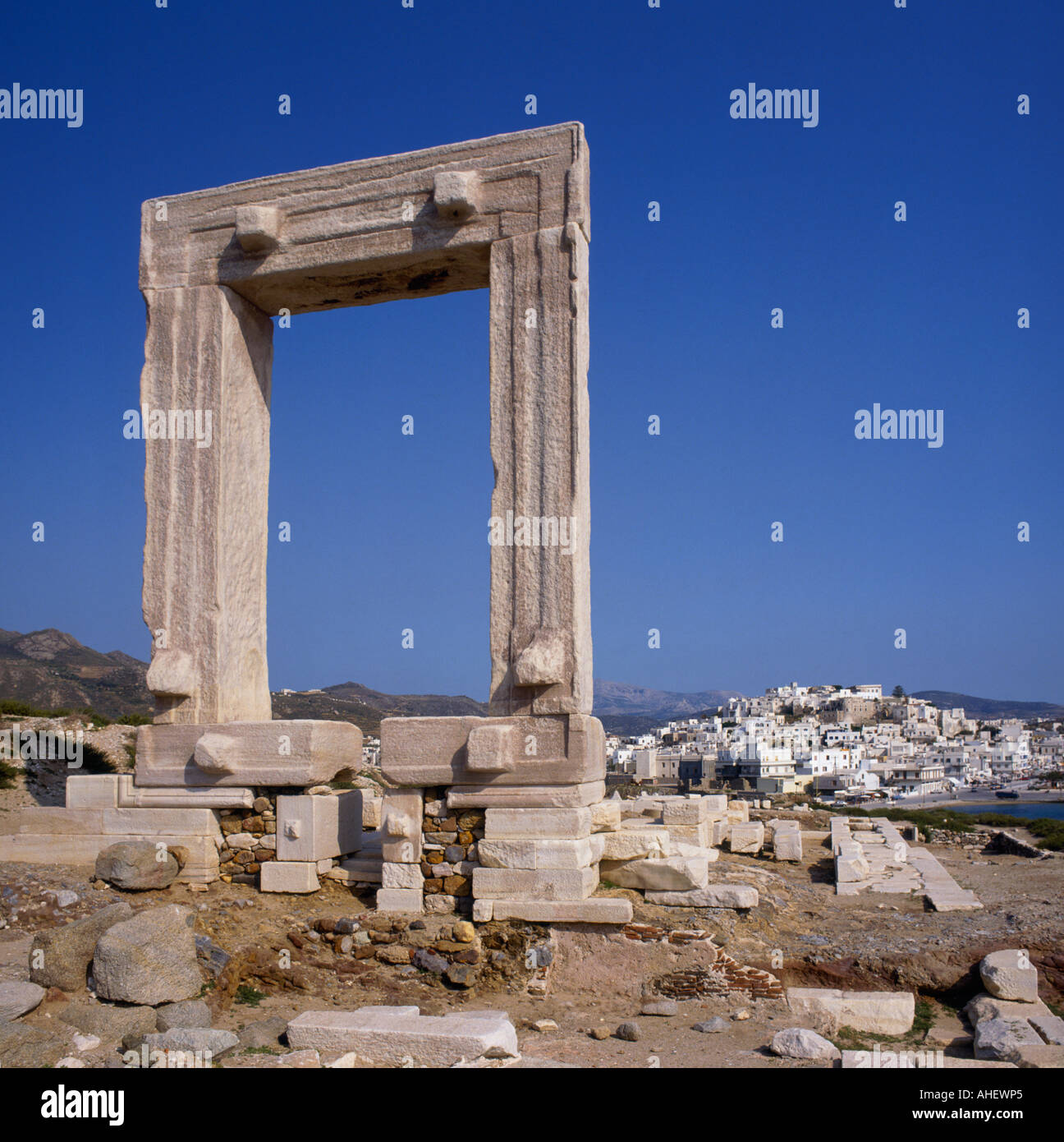 Square arched Temple of Apollo and Naxos town beyond on Naxos Island The Greek Islands Greece Stock Photo