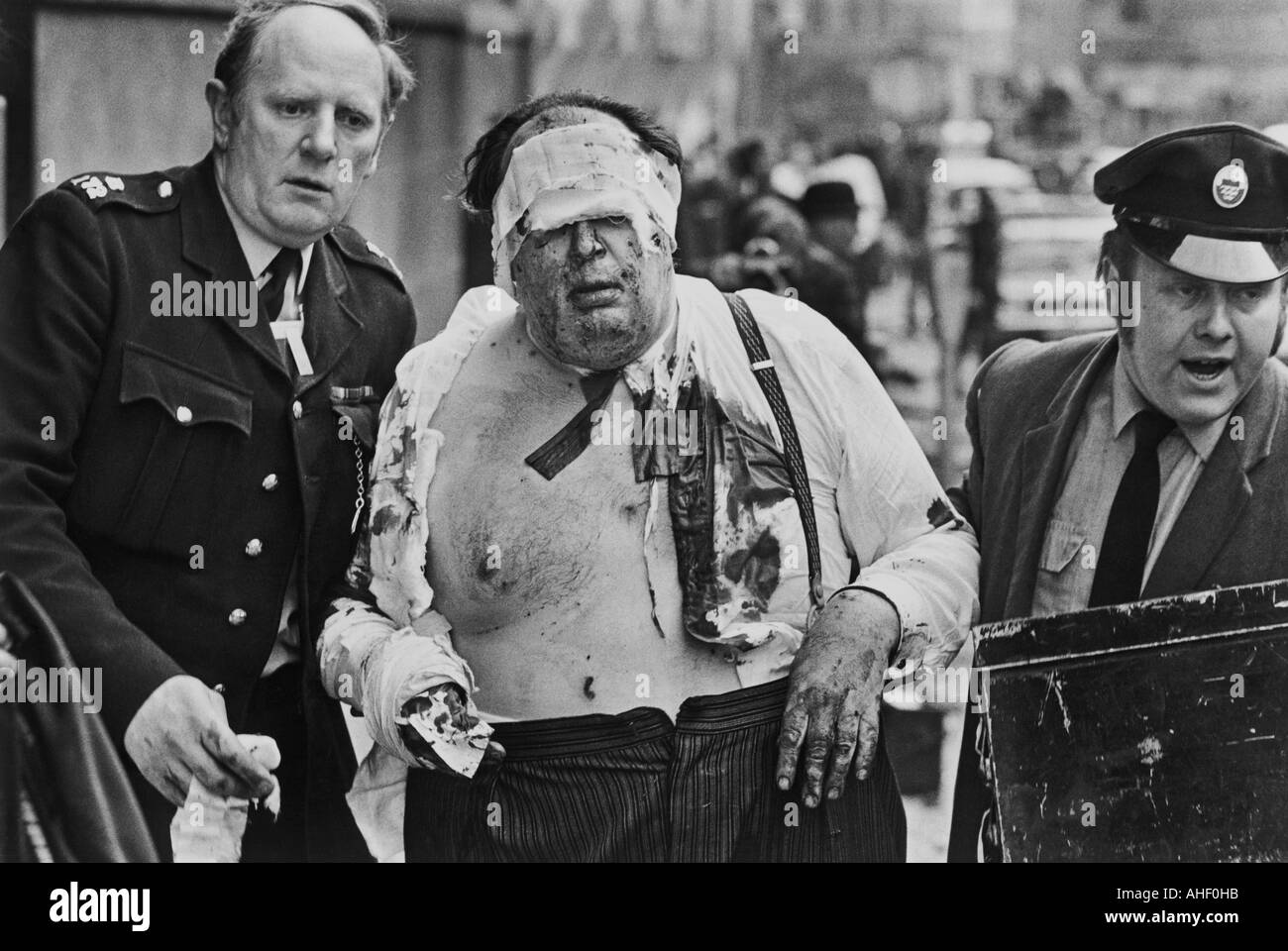 A barrister being helped to safety after the IRA bombed the Old Bailey on 8 March 1973 Stock Photo