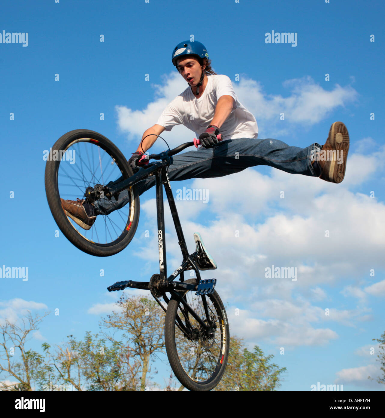 Teen Beat Rider a teenage biker jumping with his bike Stock Photo - Alamy