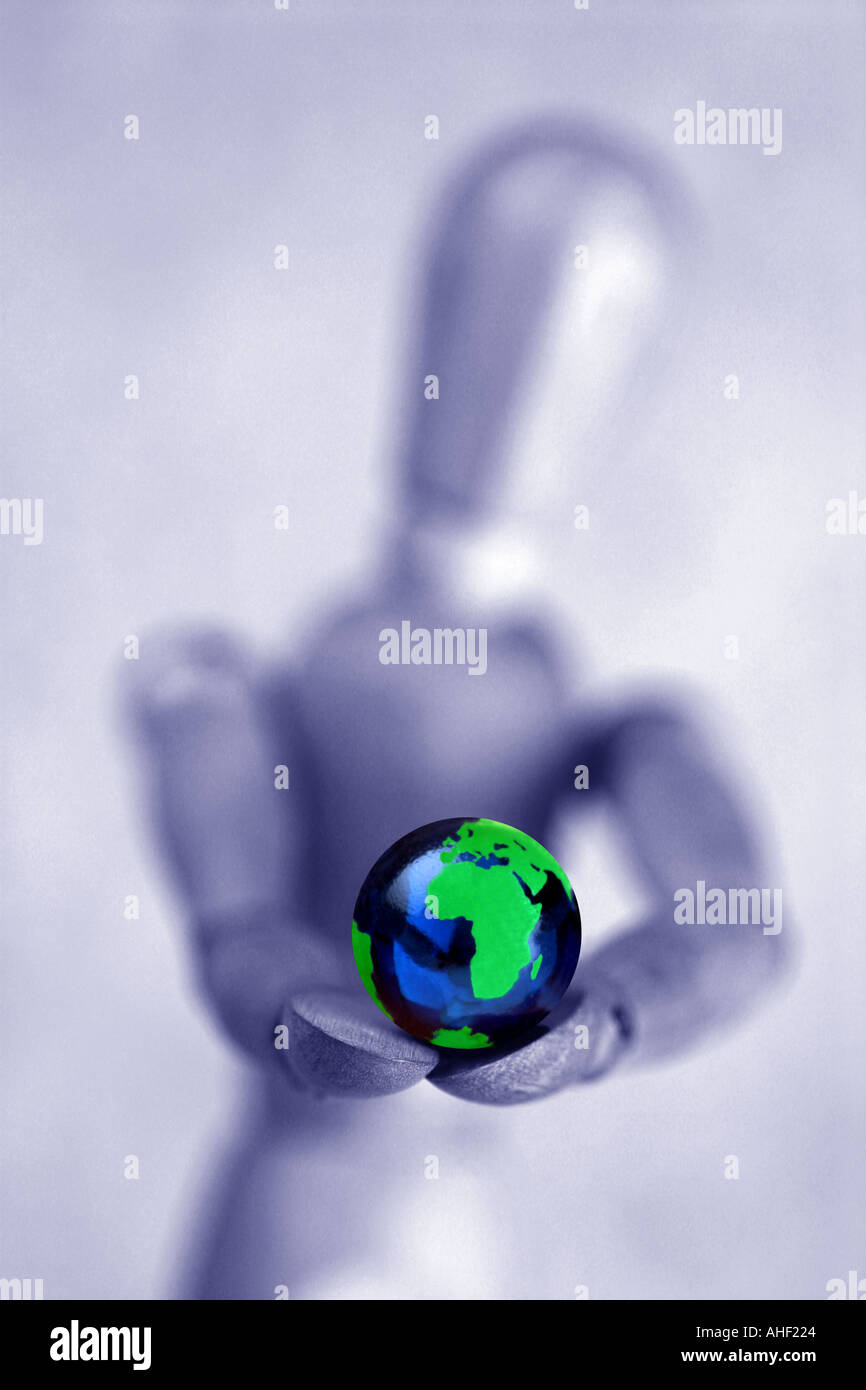 wooden figure holding a globe Stock Photo