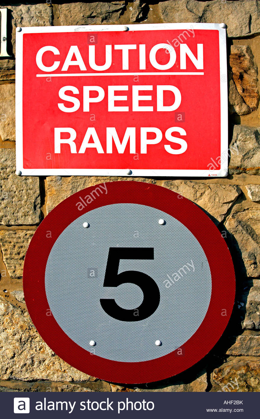 Caution Speed Ramps signpost Stock Photo - Alamy