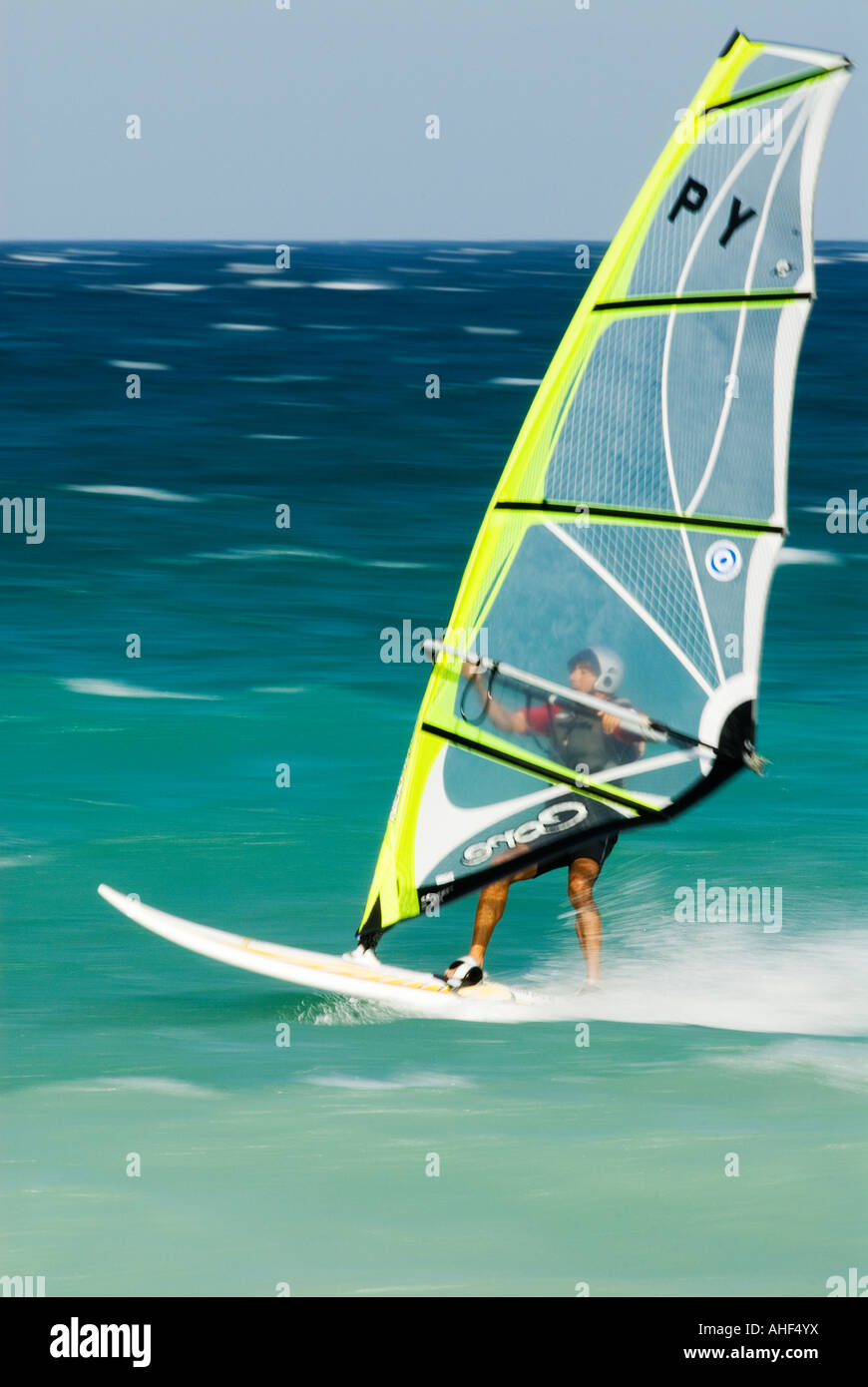 windsurfer rides the waves in the mediterranean sea Stock Photo