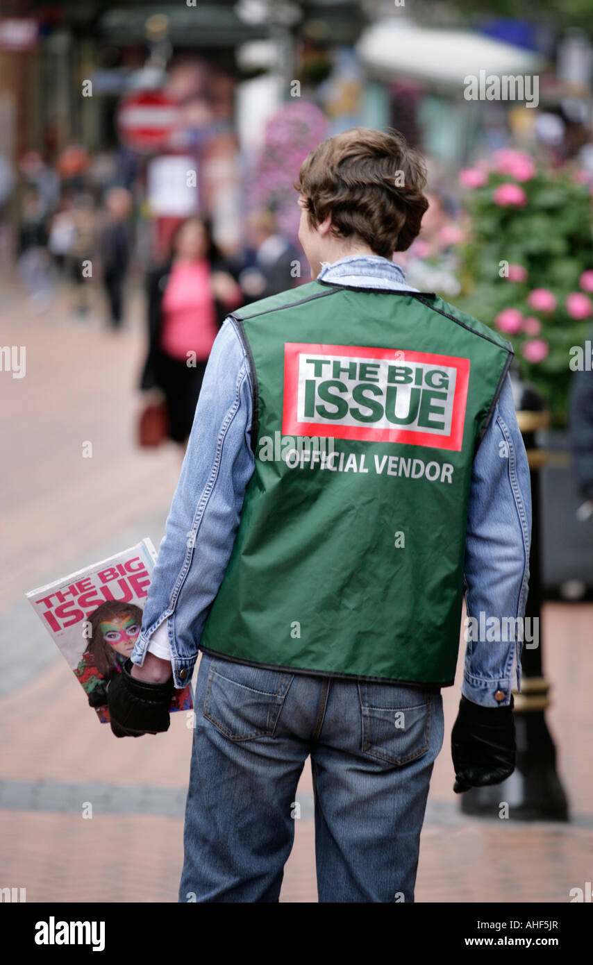 A Big Issue seller in New Street, Birmingham, UK Stock Photo