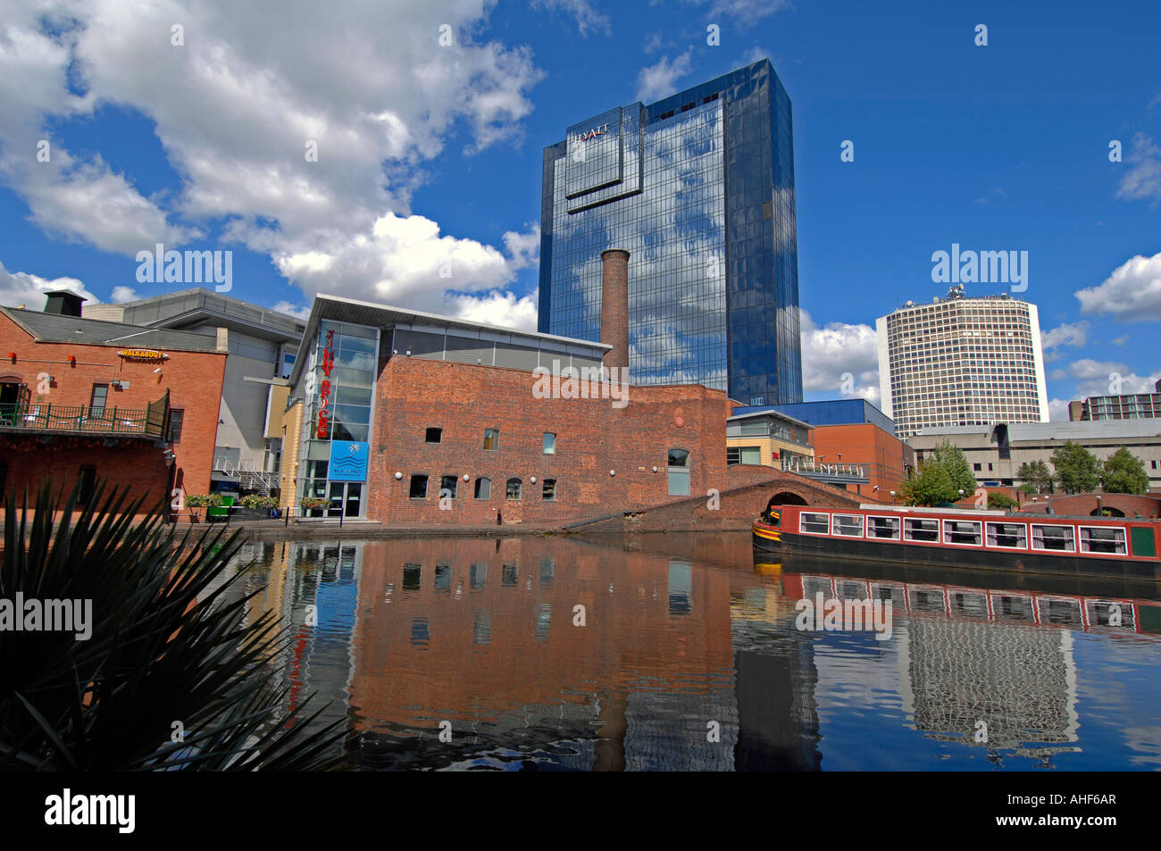 Gas Street Basin, Birmingham UK, showing  the towpath with the Hyatt Hotel in the distance. Stock Photo
