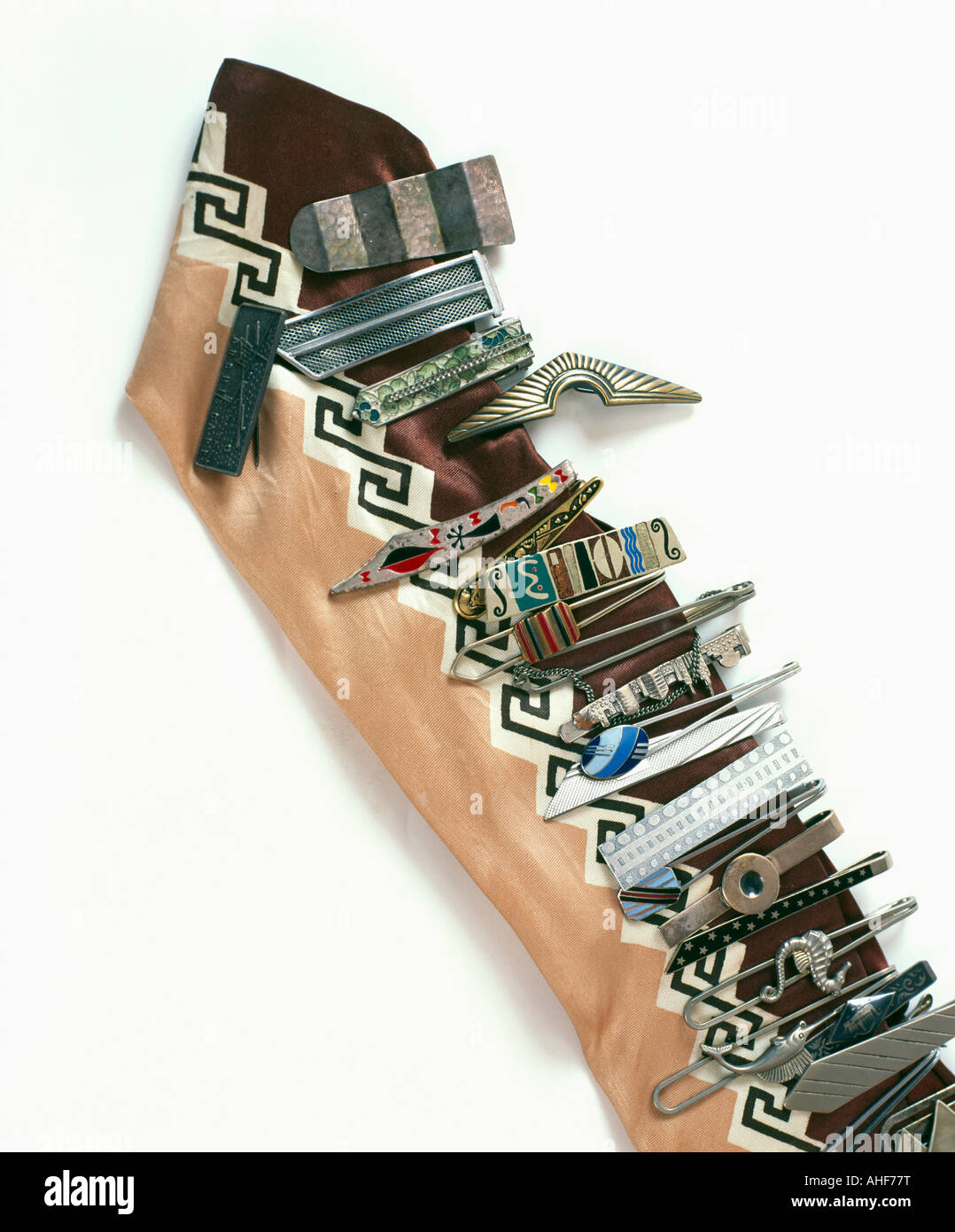 Collection of retro tiepins on silk tie Stock Photo