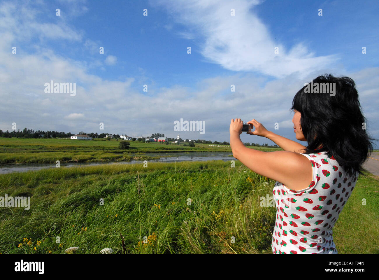 Woman taking digital pictures Stock Photo